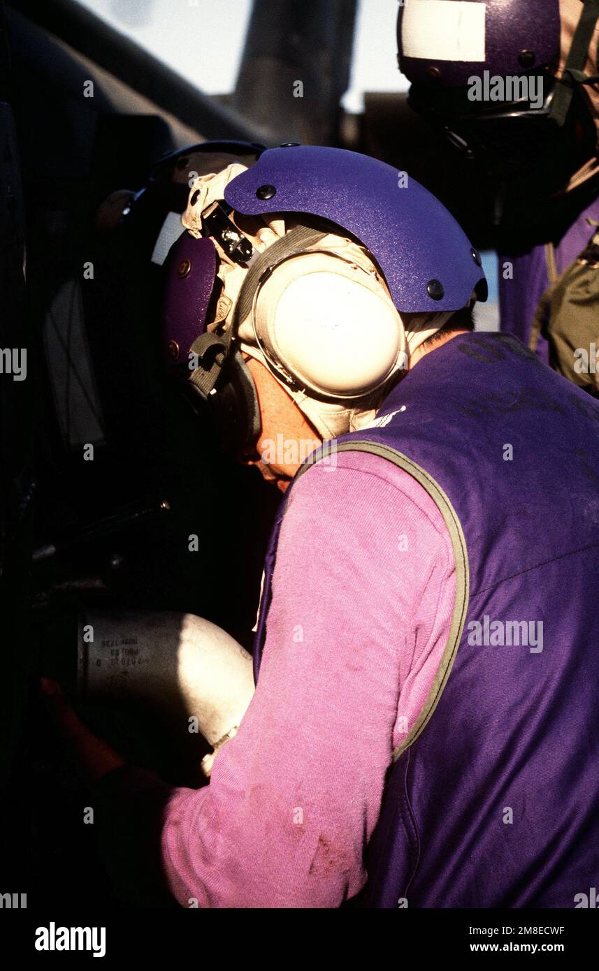 An aviation fuels crew member refuels a 45th Medical Company UH60 Black Hawk helicopter on the