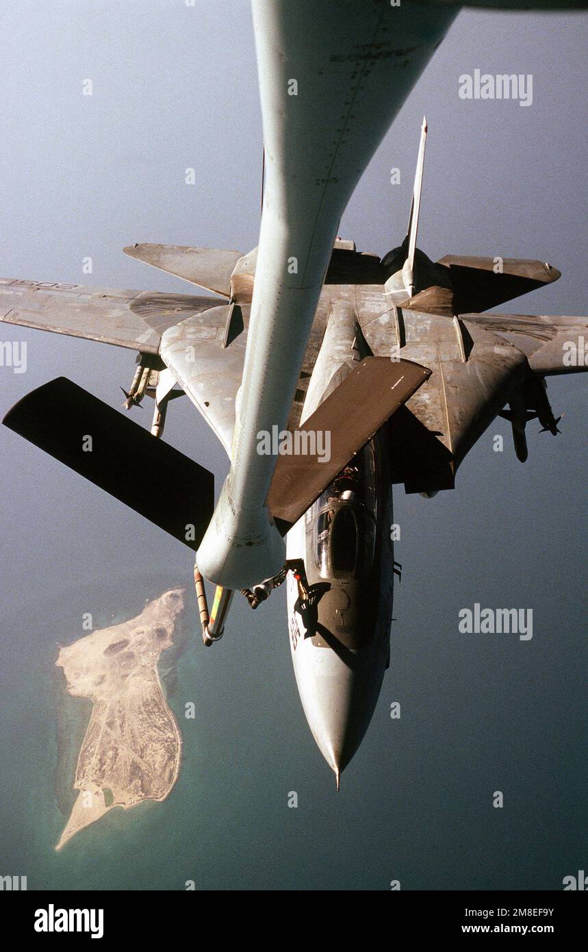 A Fighter Squadron 21 (VF-21) F-14A Tomcat aircraft is refueled by an Air Force KC-135 Stratotanker aircraft off the eastern coast of Saudi Arabia during Operation Desert Shield. The aircraft is carrying an AIM-9 Sidewinder missile on the outside portion of each wing pylon and an AIM-7 Sparrow missile on the lower part of each pylon. VF-21 is based aboard the aircraft carrier USS INDEPENDENCE (CV-62). Subject Operation/Series: DESERT SHIELD Country: Unknown Stock Photo
