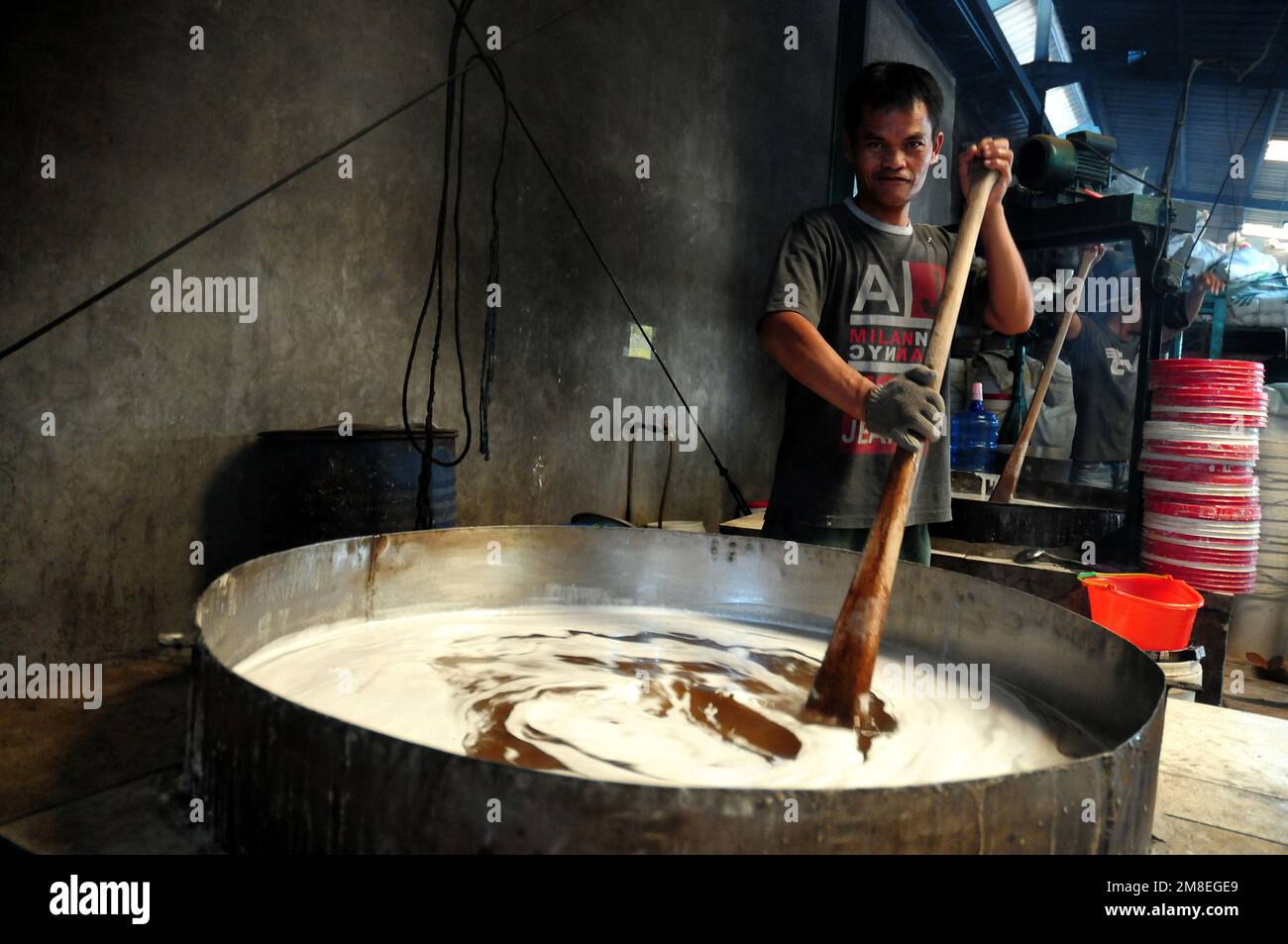 Depok, WEST JAVA, Indonesia. 12th Jan, 2023. Workers make and prepare 'Kue keranjang ' (basket cakes) at a traditional cake maker that has been running for 35 years in Depok, West Java, Indonesia, January 13, 2023. sticky rice and sugar and has a chewy and sticky texture that is cooked for 15 hours. Sales of these cakes increased ahead of the Chinese New Year celebrations, especially among the Chinese community in Indonesia. (Credit Image: © Dasril Roszandi/ZUMA Press Wire) EDITORIAL USAGE ONLY! Not for Commercial USAGE! Stock Photo