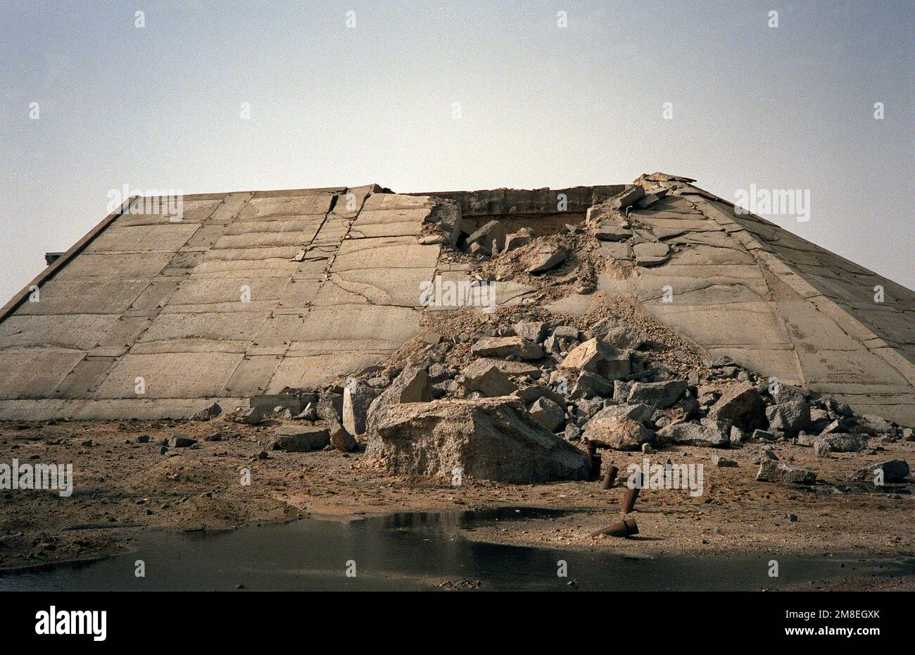 A view of a hardened aircraft hangar damaged during Operation Desert Storm. Subject Operation