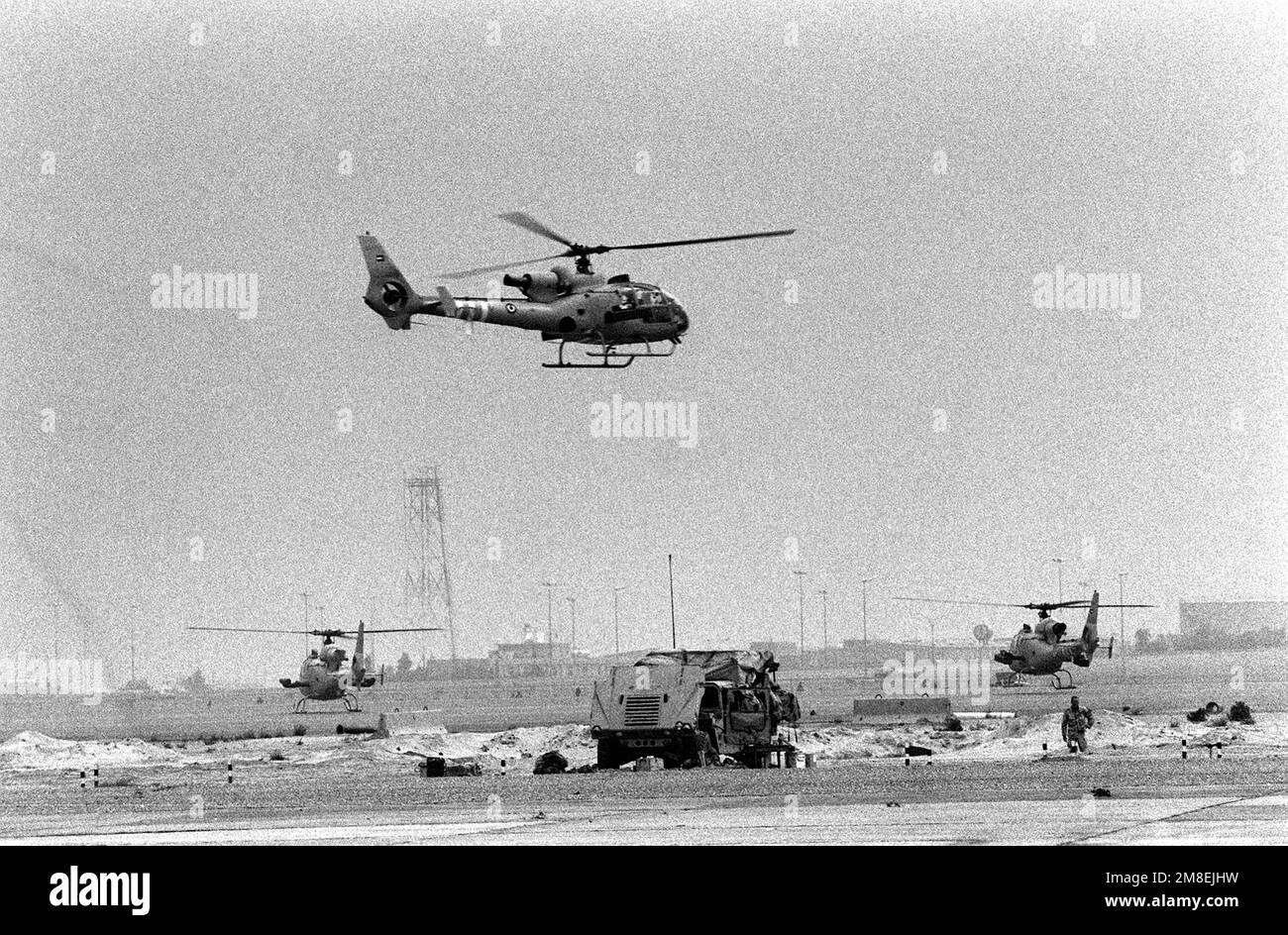 A Kuwaiti SA342M Gazelle helicopter arrives at a desert landing zone