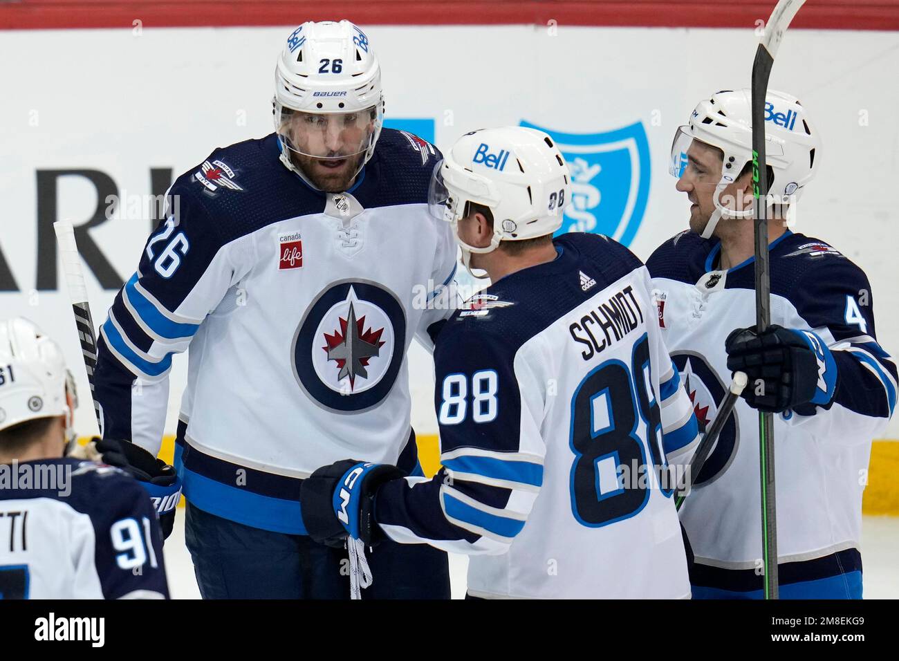 Winnipeg Jets right wing Blake Wheeler (26) is congratulated for his