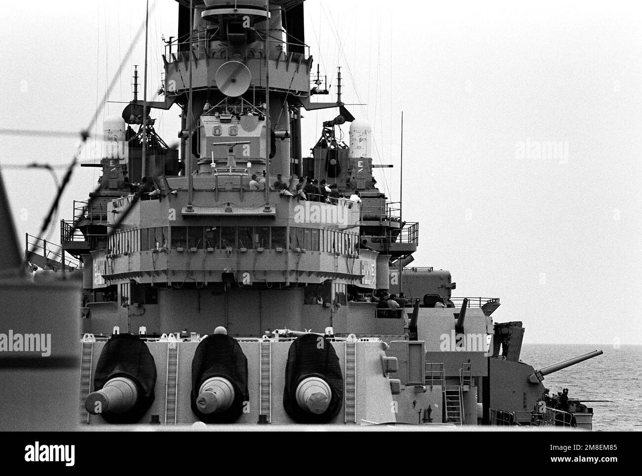 Crew members on the bridge of the battleship USS MISSOURI (BB-63) stand ...