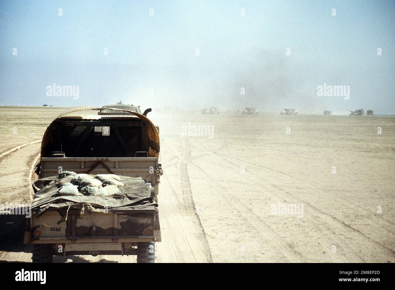 A convoy of cargo trucks from the 2nd Marine Expeditionary Force rolls into Kuwait at the start of the ground phase of Operation Desert Storm. Subject Operation/Series: DESERT STORM Country: Kuwait (KWT) Stock Photo