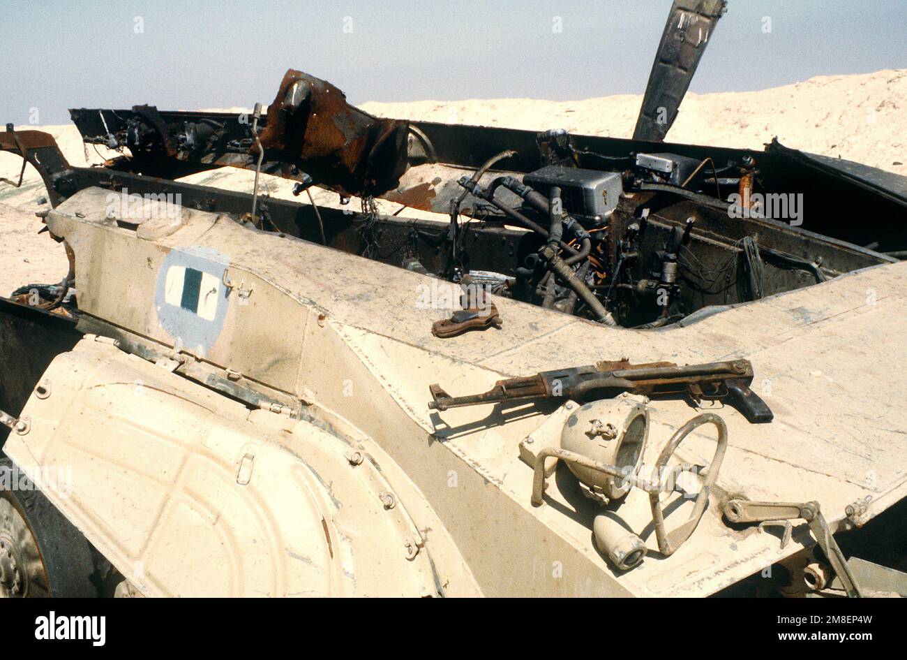 A charred AKM assault rifle and a flare pistol lie on the hull of a destroyed Iraqi BMP-1 mechanized infantry combat vehicle during the ground phase of Operation Desert Storm. Subject Operation/Series: DESERT STORM Country: Kuwait (KWT) Stock Photo