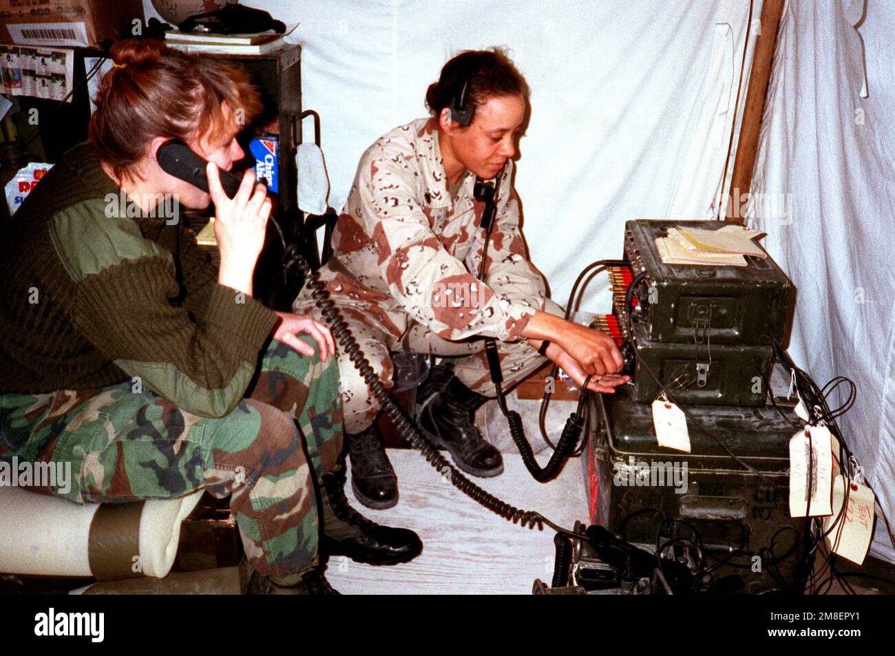 Hospital corpsmen set up a communications station at a field hospital during Operation Desert Storm. Subject Operation/Series: DESERT STORM Country: Saudi Arabia (SAU) Stock Photo