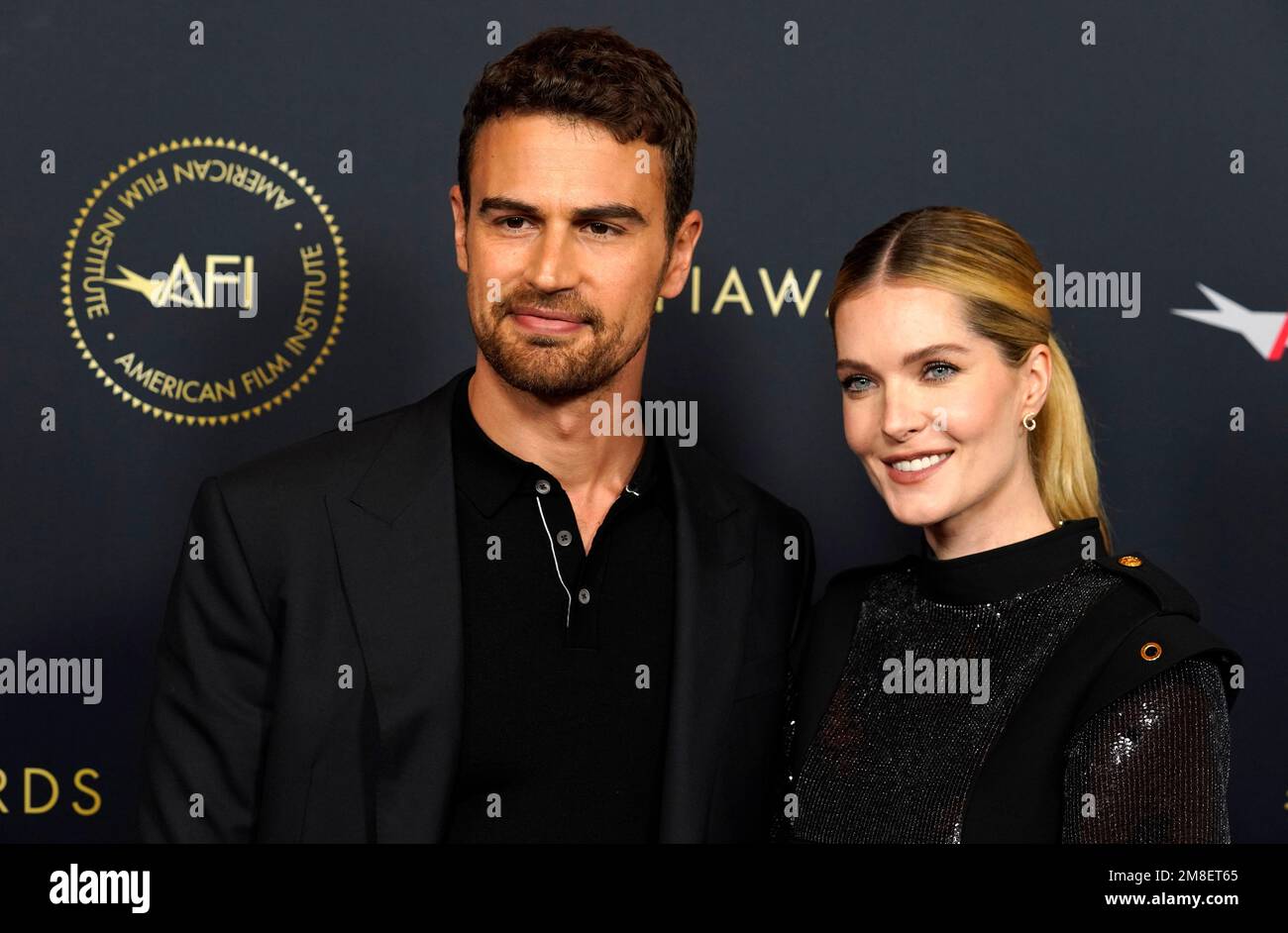 Actors Theo James, left, and Meghann Fahy pose together at the 2023 AFI