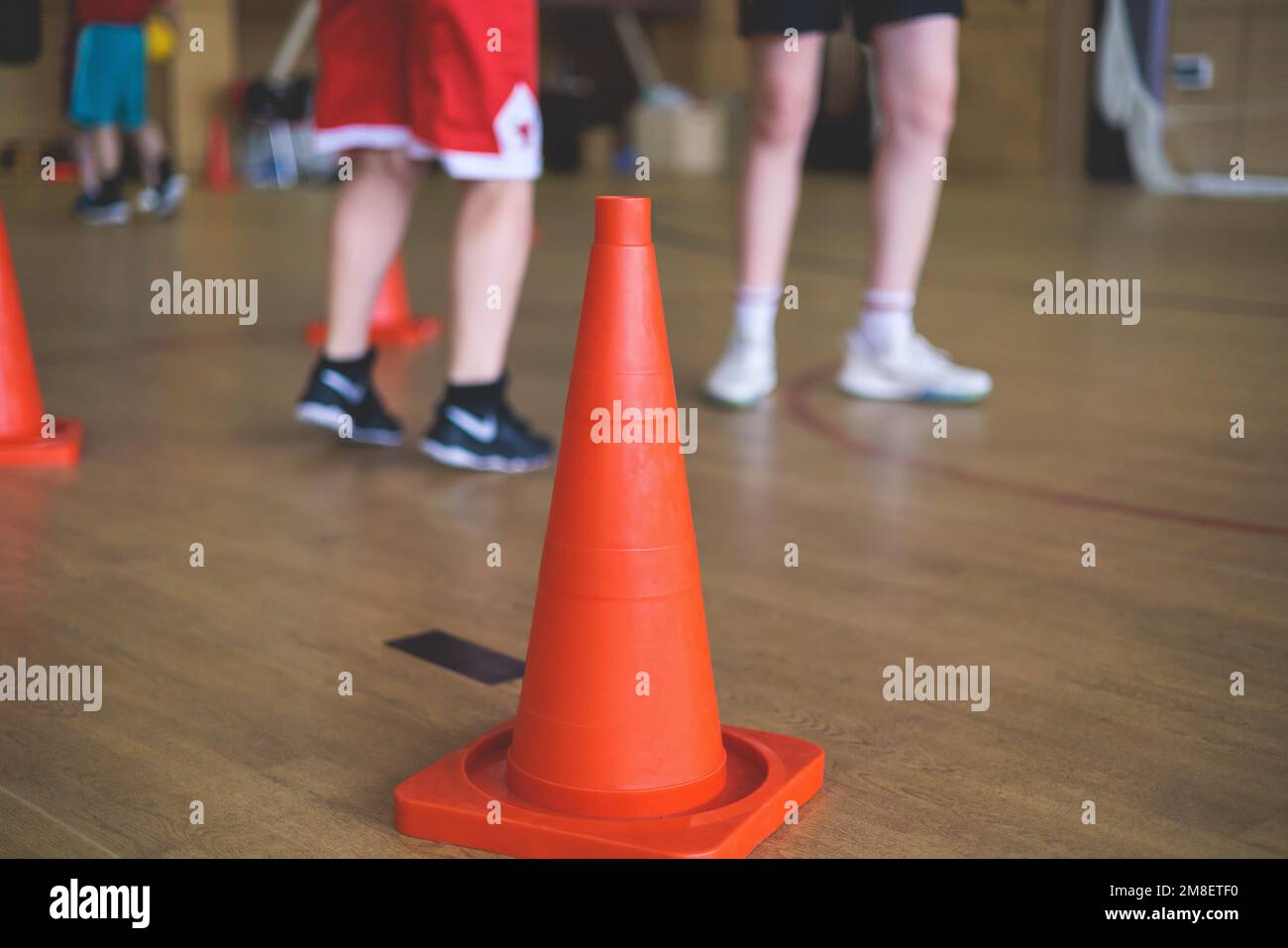 Junior teenage school team of kids children play basketball, players in the hall indoor venue court, sports team during game, playing indoor match gam Stock Photo