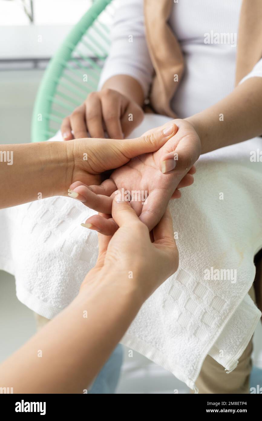 fingers and joints of the hands, massage as therapy to parts of the