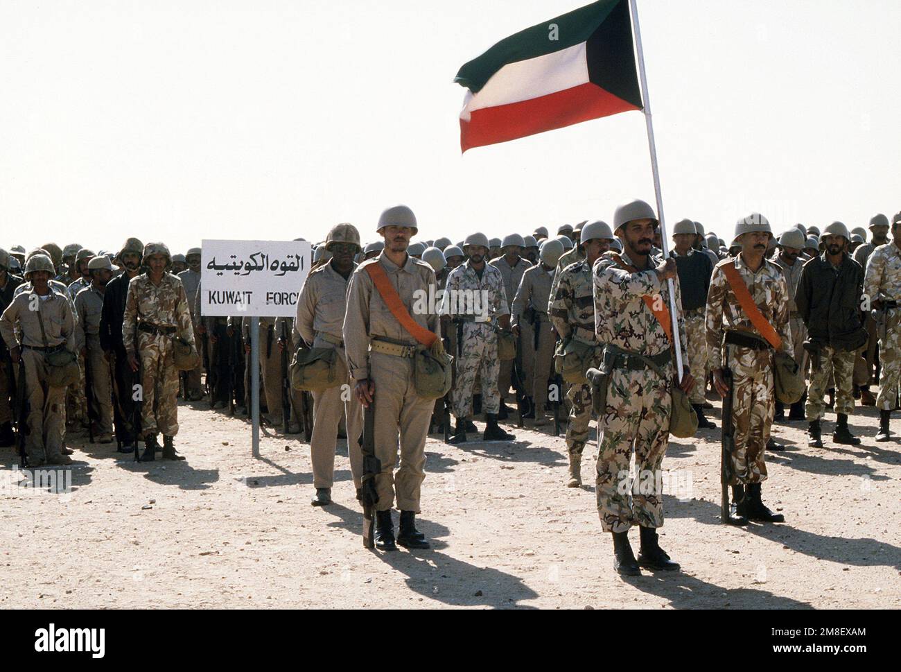Kuwaiti troops stand ready for review by King Fahd of Saudi Arabia as