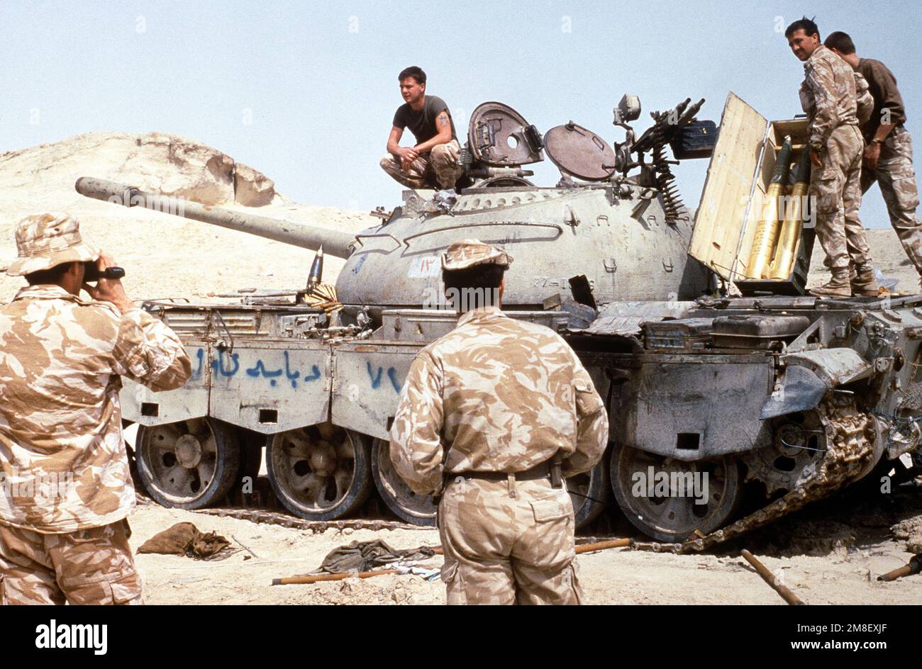British troops are photographed atop an Iraqi T55 main battle tank