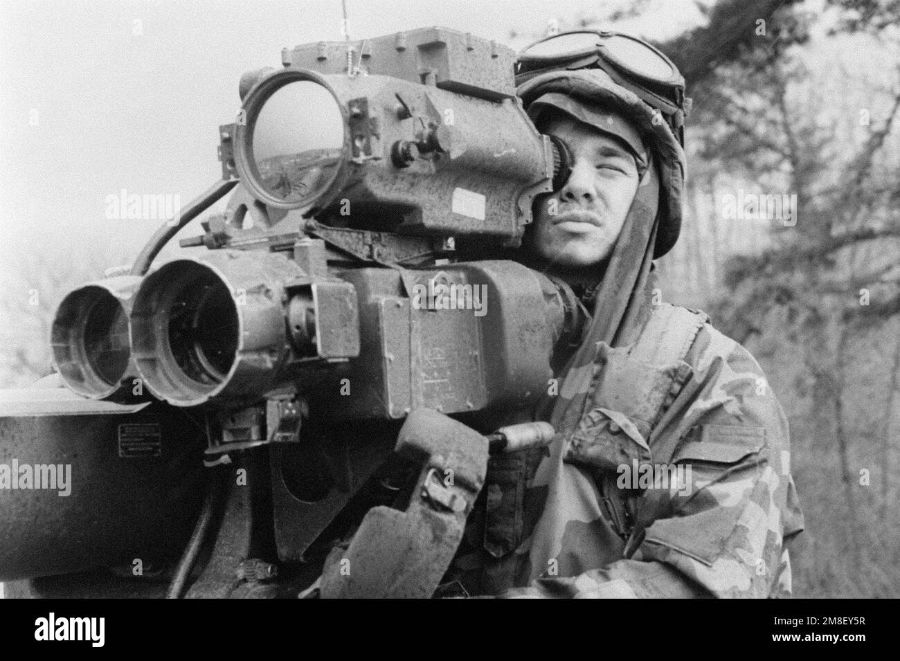 Close-up of a soldier from the 2nd Infantry Division, Orange team, as he looks through the sight of a Tube-launched, Optically tracked, Wire guided missile system (TOW). Subject Operation/Series: TEAM SPIRIT '91 Base: Inchon Country: South Korea Stock Photo