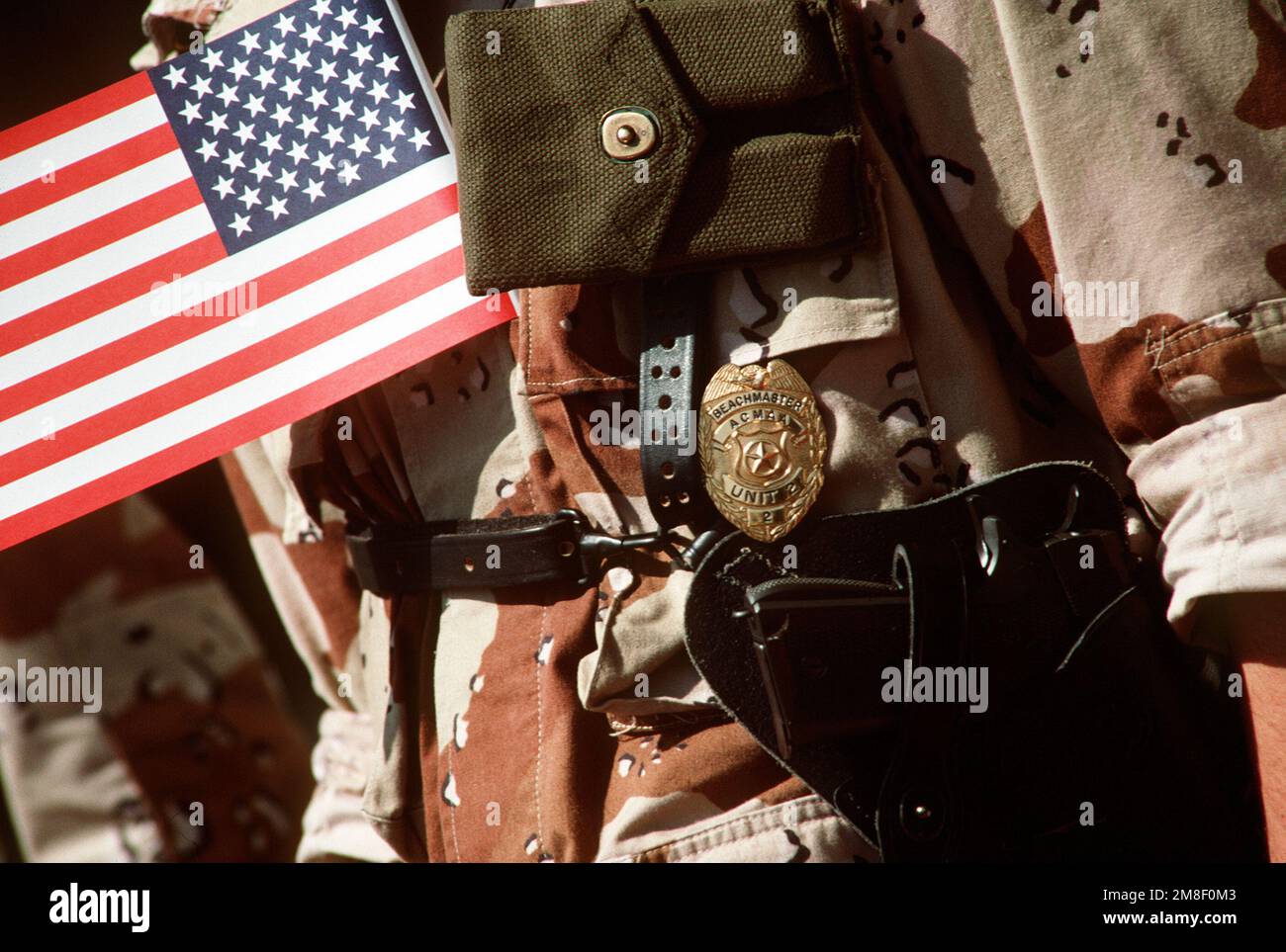 A close-up view of the master-at-arms (MAA) badge worn by a member of ...