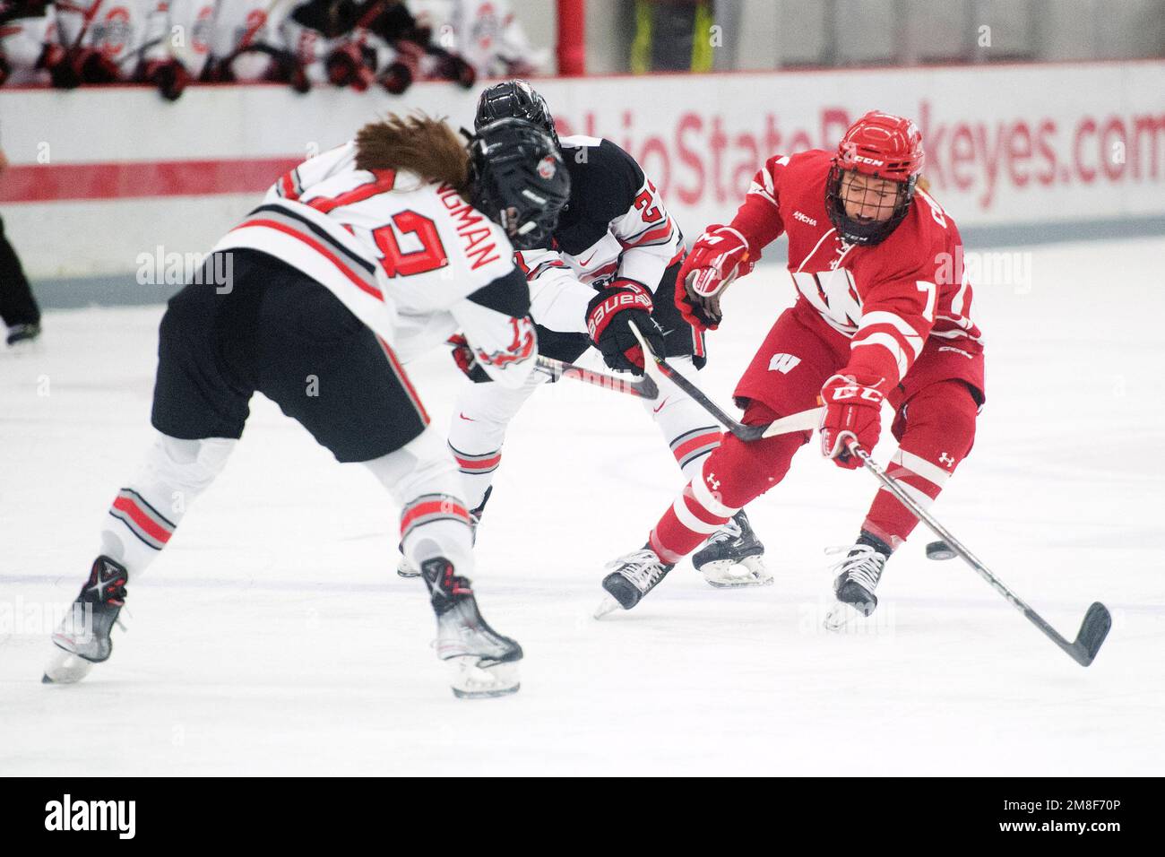 Columbus, Ohio, USA. 13th Jan, 2022. Wisconsin Badgers forward Jesse Compher (7) blocks Ohio State Buckeyes defenseman Riley Brengman's (13) pass in their game in Columbus, Ohio. Brent Clark/CSM/Alamy Live News Stock Photo