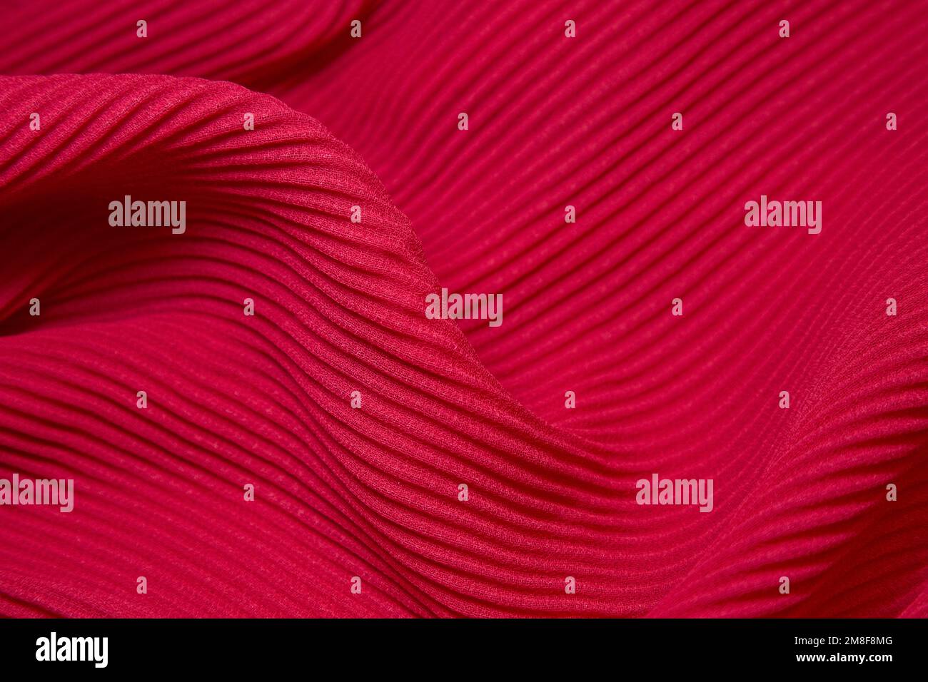 Pink fabric background. Pink cloth waves background texture. Pink