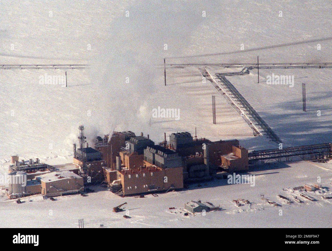 An aerial view of a cluster of buildings at an unidentified facility