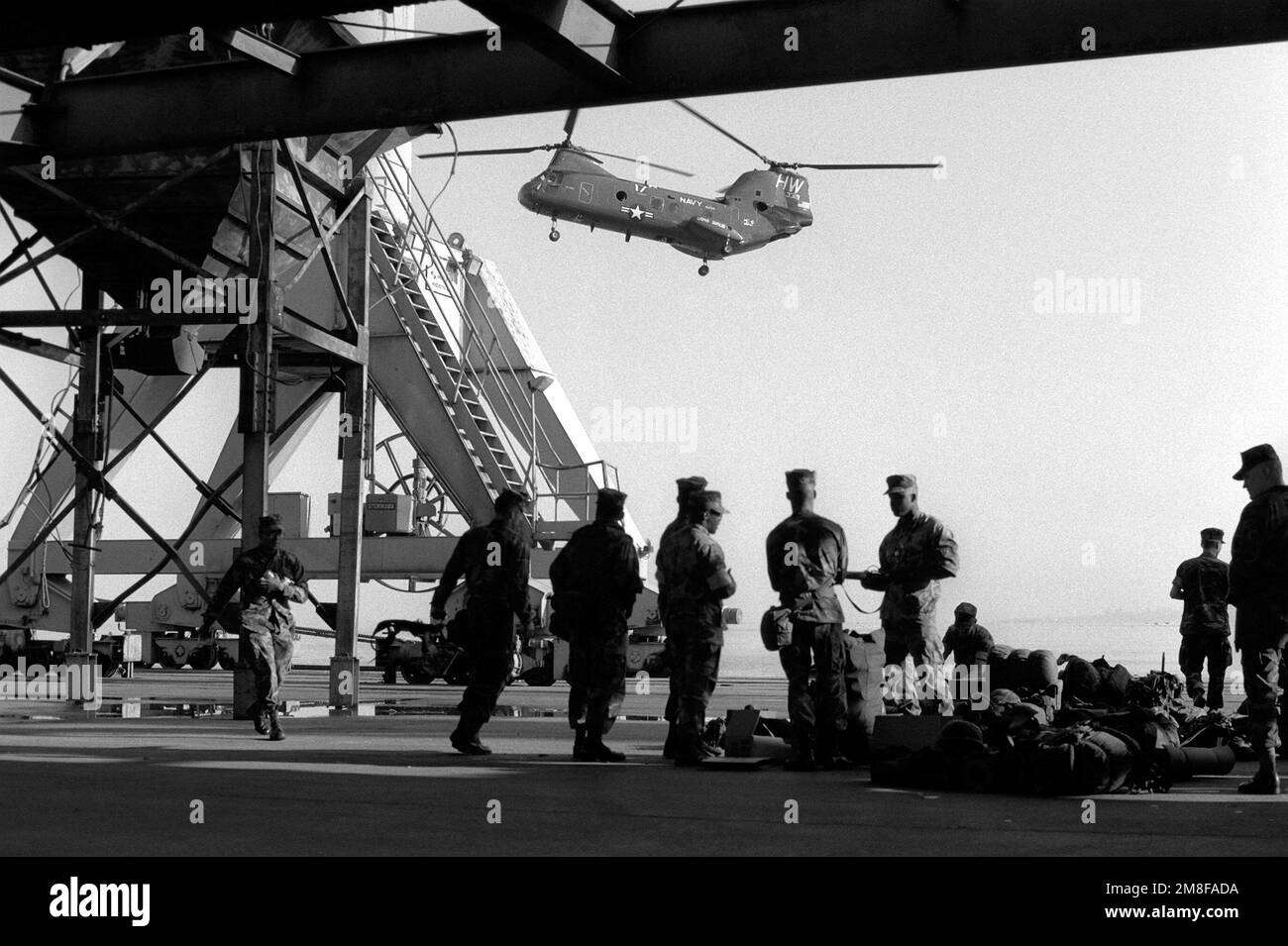 Military combat helicopter flies Black and White Stock Photos & Images ...