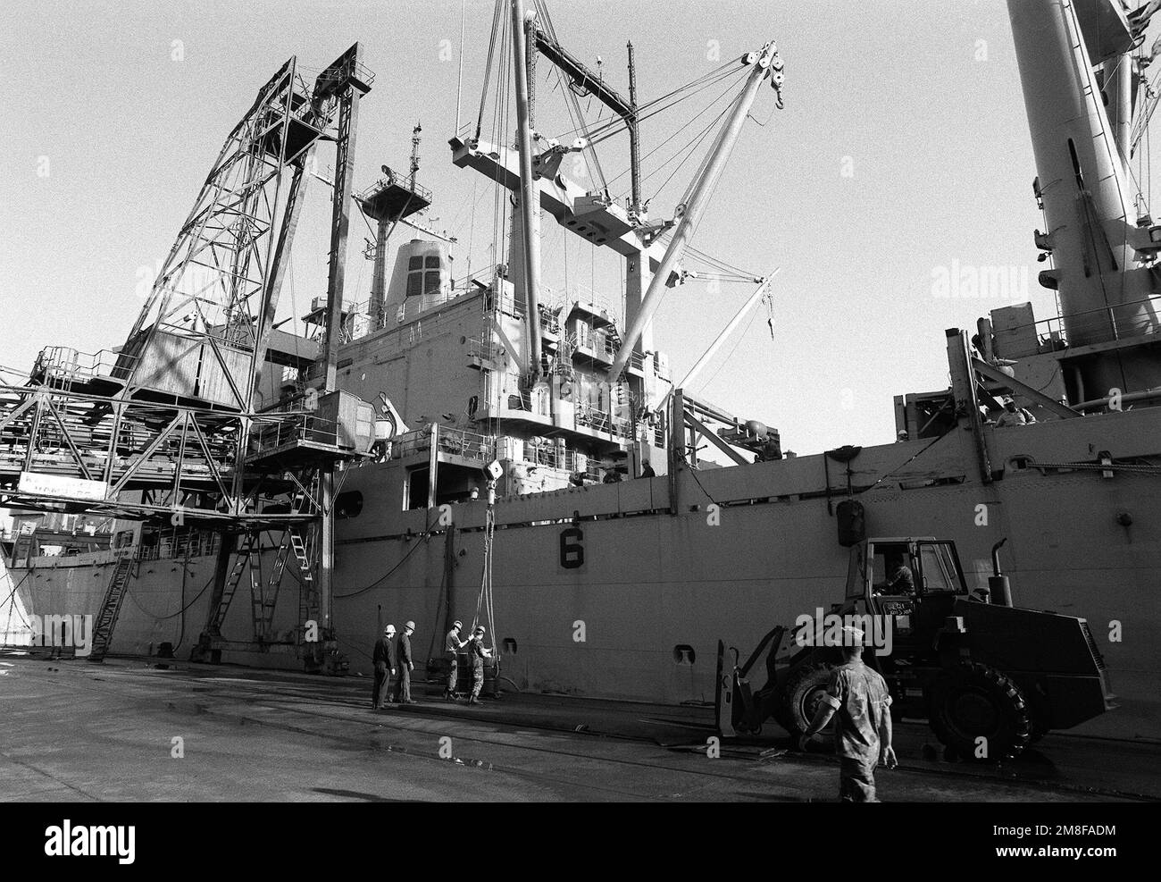 The amphibious cargo ship USS CHARLESTON (LKA-113) stands at the pier as equipment is offloaded during Operation Provide Comfort, an Allied effort to aid Kurdish refugees who fled from the forces of Saddam Hussein in northern Iraq. Subject Operation/Series: PROVIDE COMFORT Base: Iskenderum Country: Turkey (TUR) Stock Photo