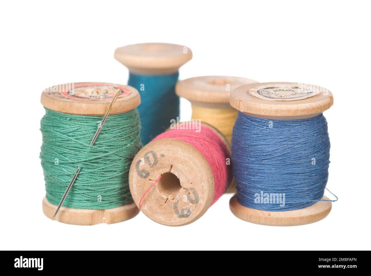 Vintage thread reels isolated on white Stock Photo Alamy