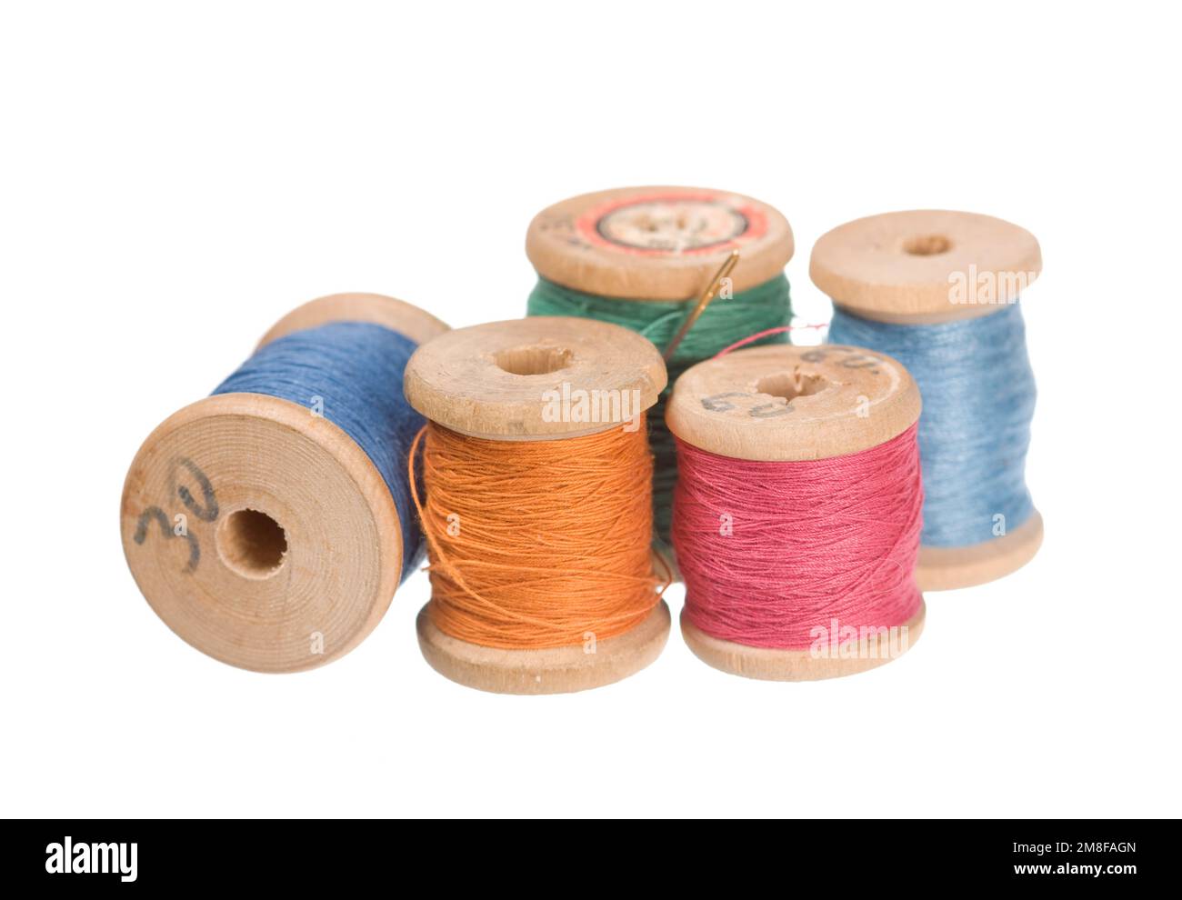 Vintage thread reels isolated on white Stock Photo