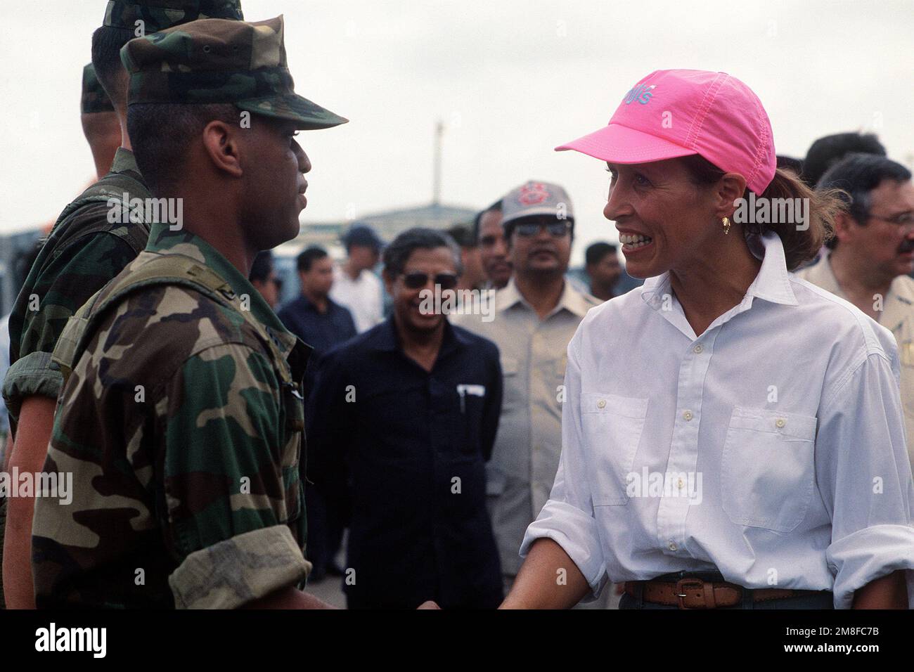 Marilyn Quayle, wife of Vice President Dan Quayle, greets Marines upon her arrival at Chittagong Airport. Mrs. Quayle is in Bangladesh to represent the United States as part of Operation Sea Angel, a U.S. military effort to provide disaster relief to victims of a cyclone which devastated the country on April 30th.. Subject Operation/Series: SEA ANGEL Country: Bangladesh(BGD) Stock Photo