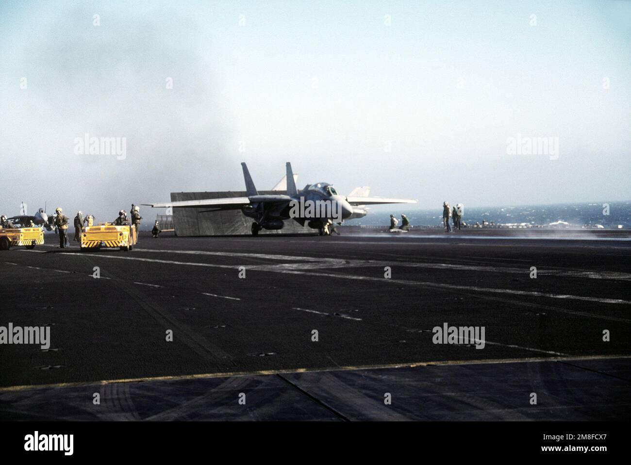 A Fighter Squadron 114 (VF114) F14A Tomcat aircraft stands by for