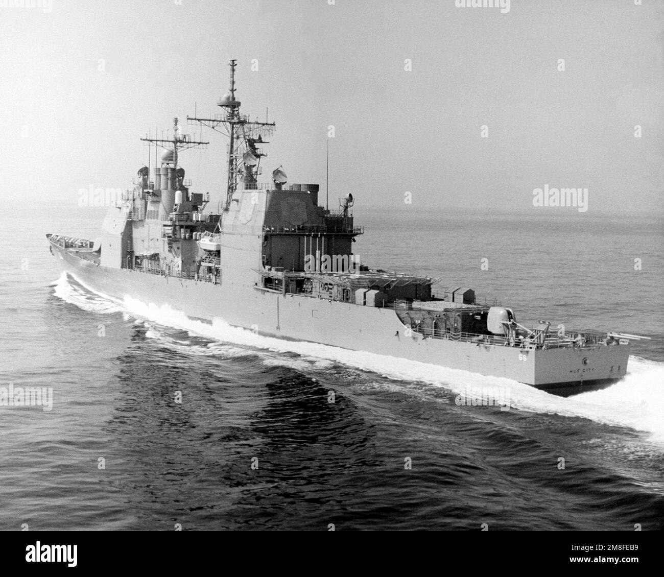 A port quarter view of the guided missile cruiser USS HUE CITY (CG 66