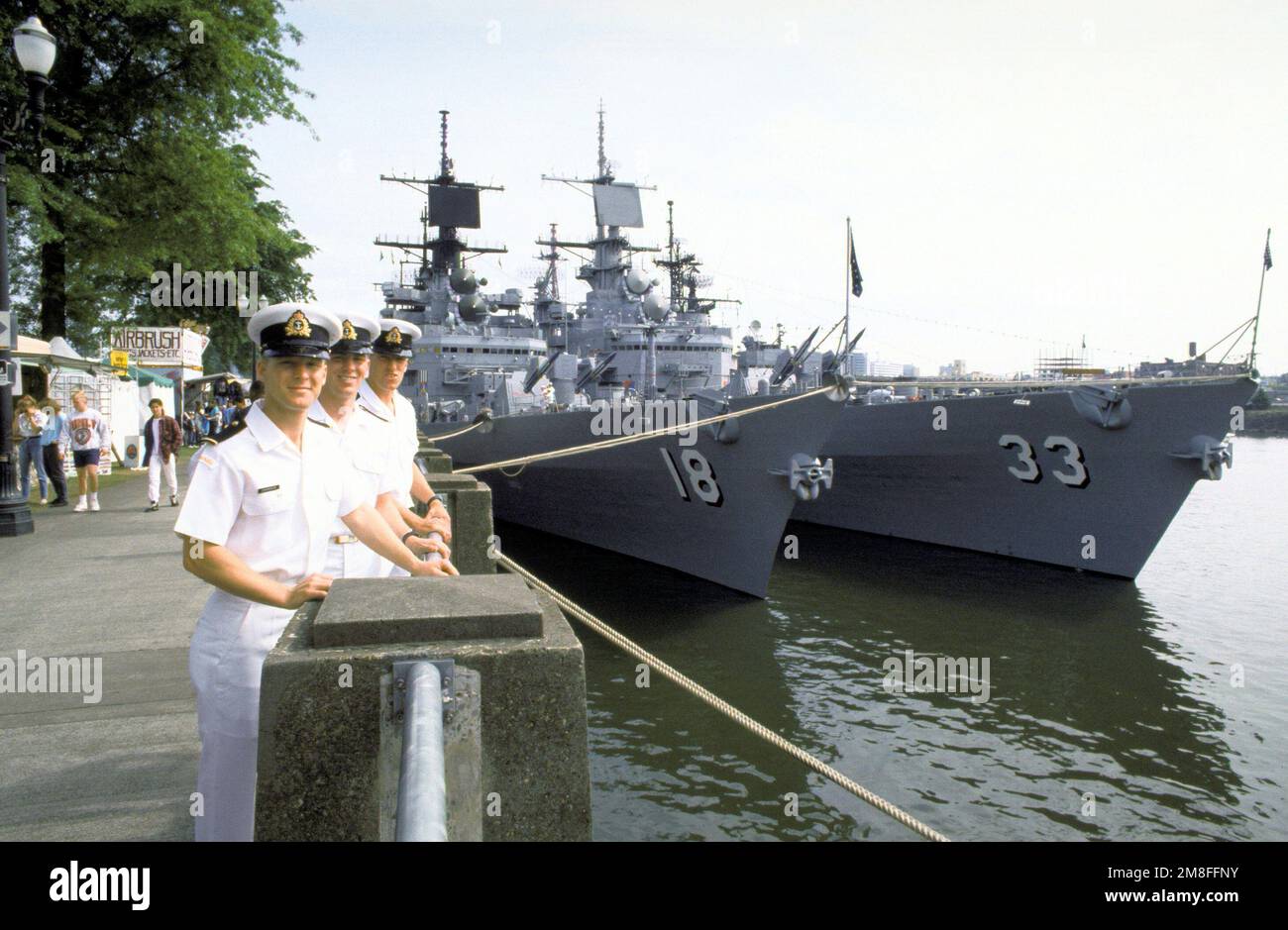 Canadian Navy midshipmen pose in front of U.S. Pacific Fleet guided missile cruisers USS WORDEN CG 18 and USS FOX CG 33 during Portland s annual Rose Festival. Complete Scene Caption Canadian Navy mid...