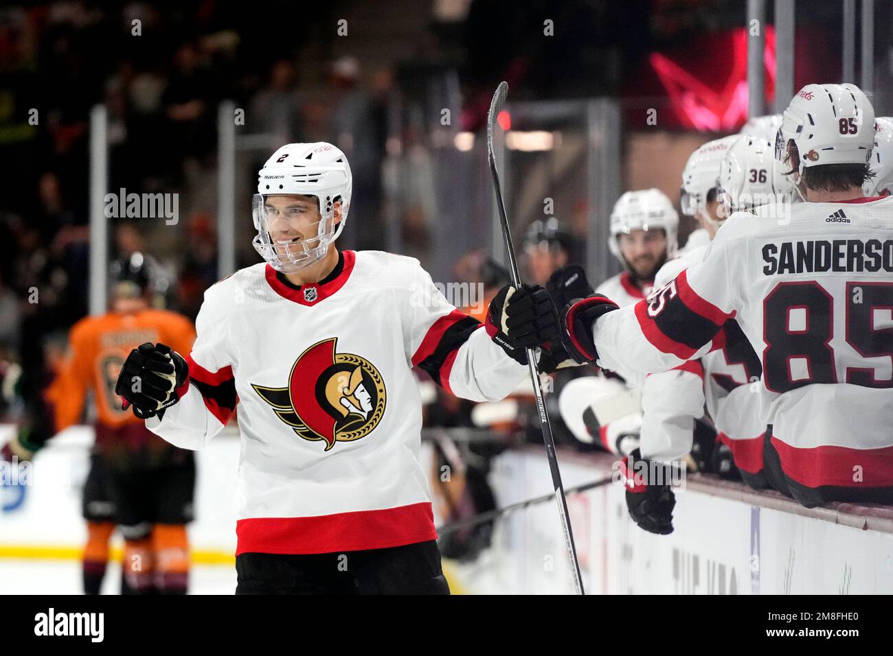 Ottawa Senators defenseman Artem Zub, left, smiles as he celebrates his