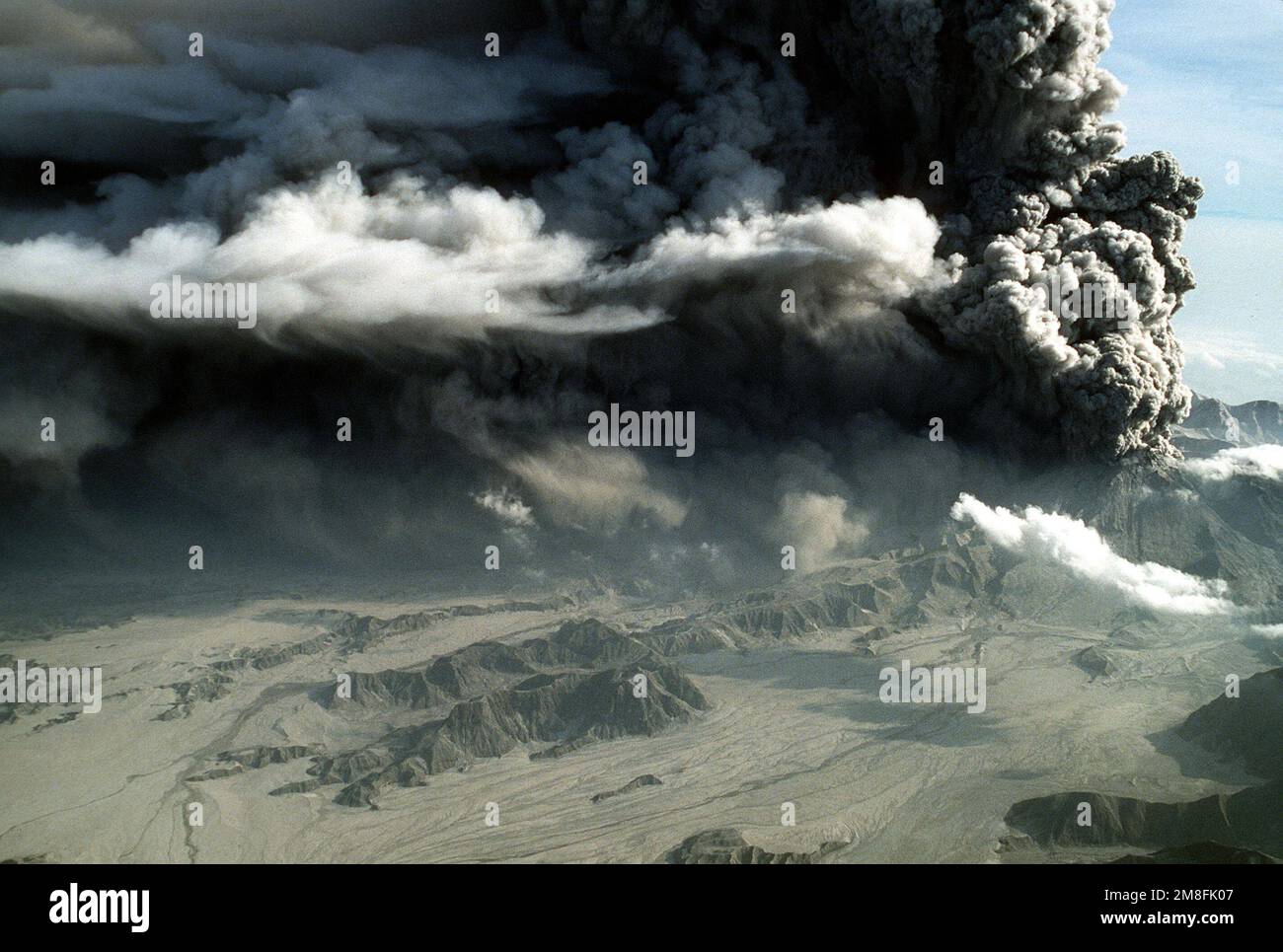 Volcanic ash fills the sky around Mount Pinatubo during its eruption
