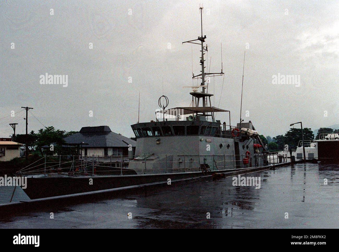The Western Samoan patrol boat NAFANUA lies tied up at the pier. The