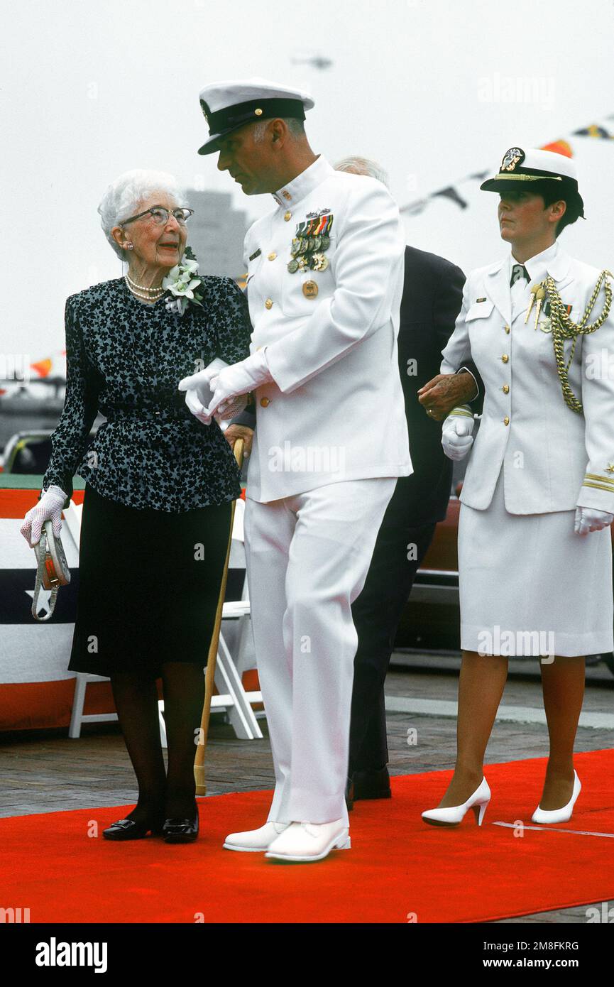 Command MASTER CHIEF Gary L. Barnes escorts Roberta Burke, wife of