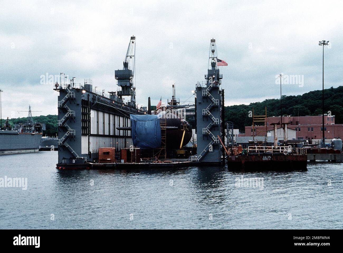 A Sturgeon class nuclearpowered attack submarine sits in dry dock