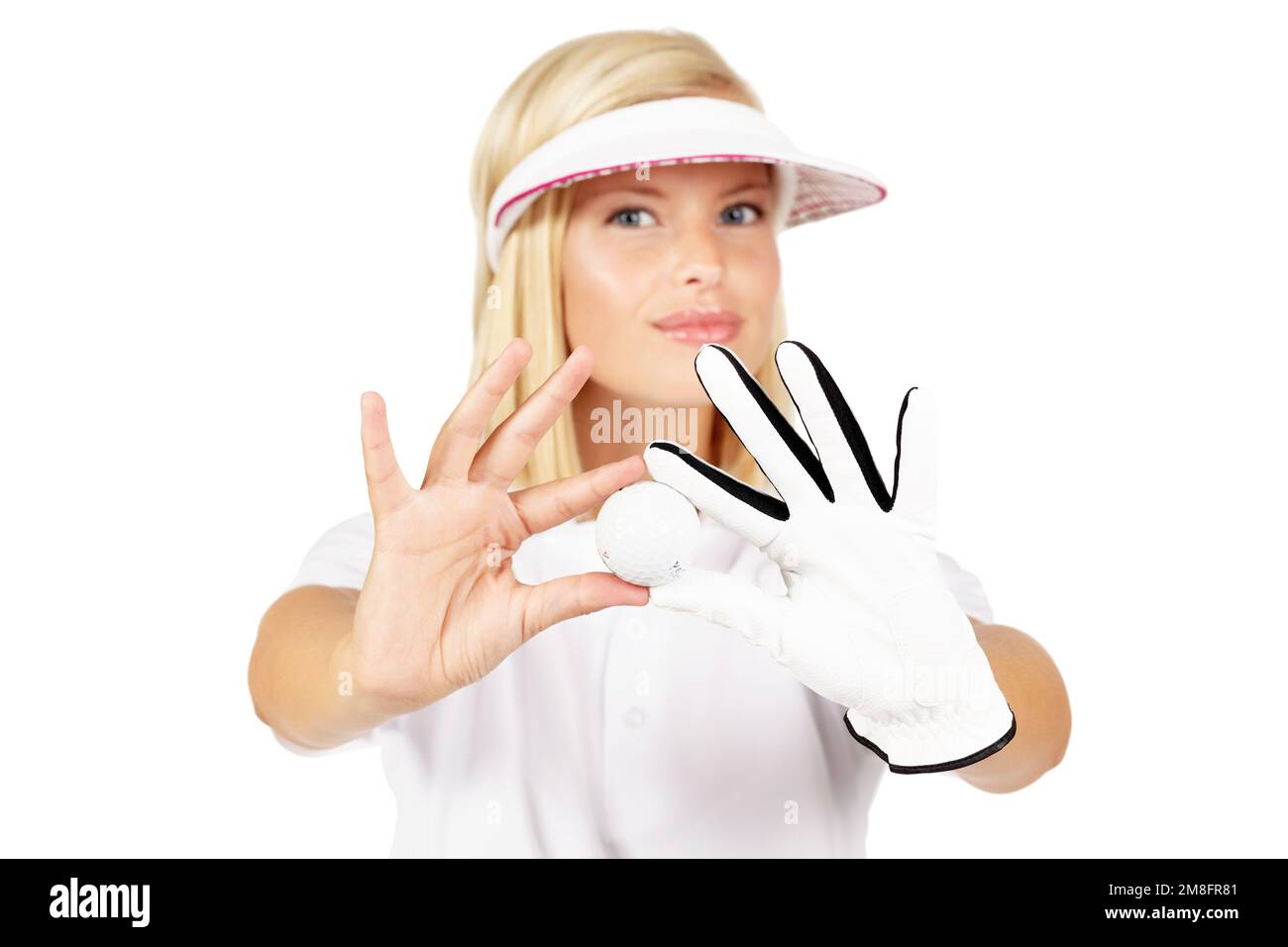 Portrait, golf ball and white background of woman in studio with glove hands, sports uniform and