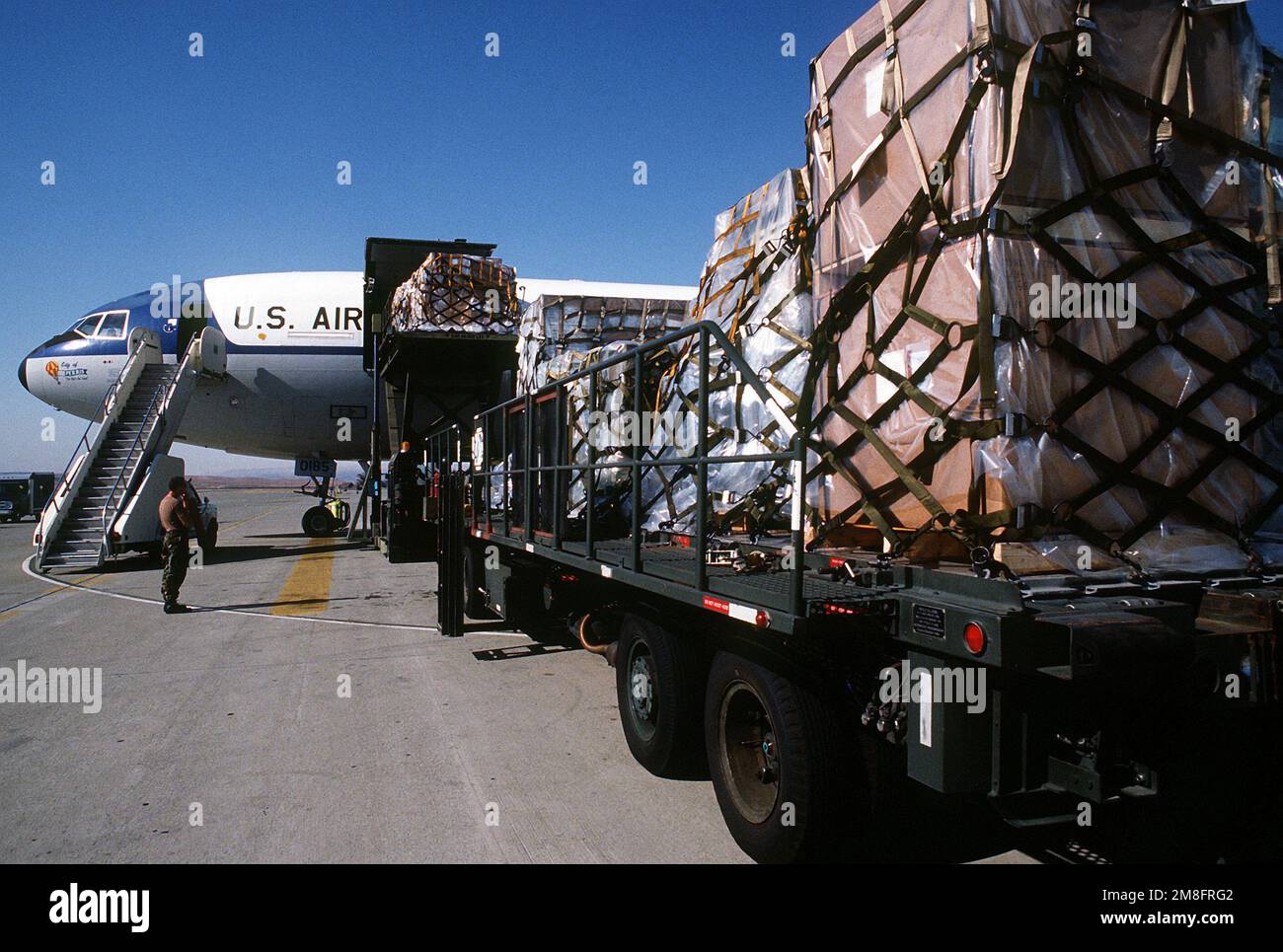 Pallets of cargo are unloaded from a KC-10A Extender aircraft at the completion of a Military Airlift Command channel cargo mission. The aircraft and its crew are both from the 6th Air Refueling Squadron, 22nd Air Refueling Wing. Base: Travis Air Force Base State: California (CA) Country: United States Of America (USA) Stock Photo