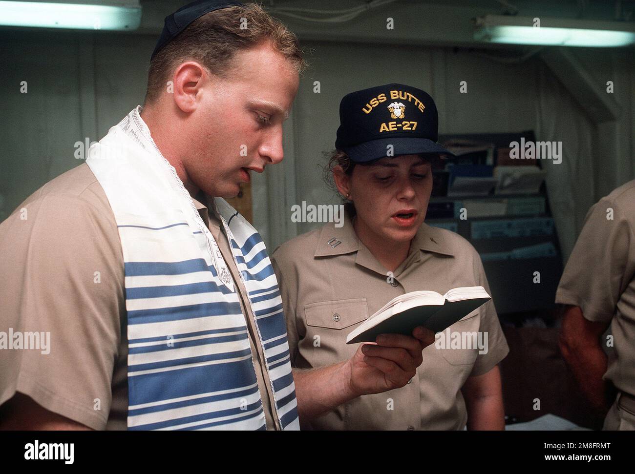Chaplain (LT.) Jane E. Feerer, right, takes part in a Jewish worship service aboard the ammunition ship USS BUTTE (AE-27). Base: Gaeta Country: Italy(ITA) Stock Photo