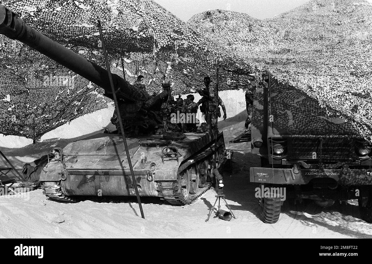 Marines from Btry. R, 5th Bn., 11th Marines, stand aboard their M110A2 selfpropelled 8inch