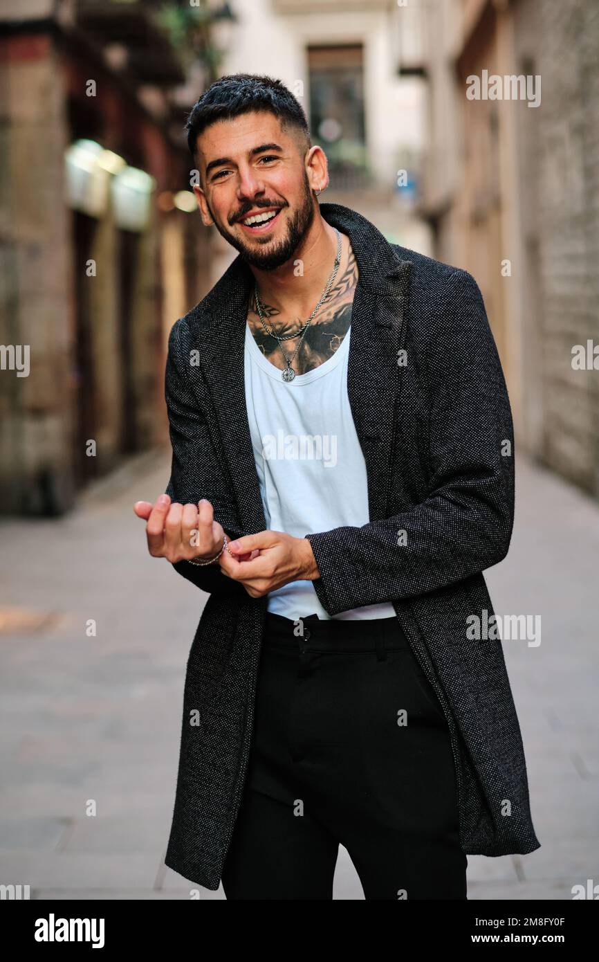 Happy handsome man posing with elegant informal clothes outdoors Stock Photo