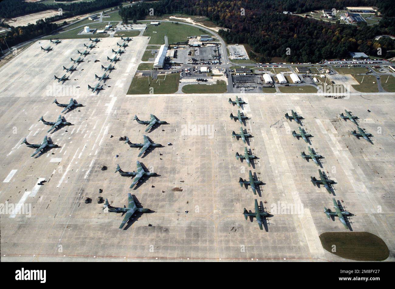 C-141B Starlifter aircraft of the 62nd Military Airlift Wing and C-130E ...