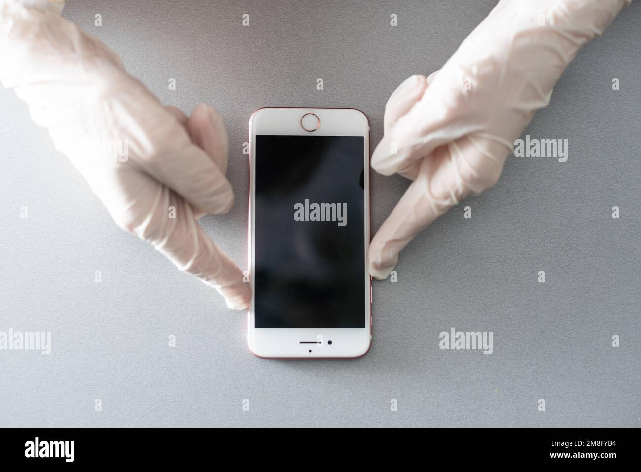 hands holding pressing smartphone buttons Stock Photo
