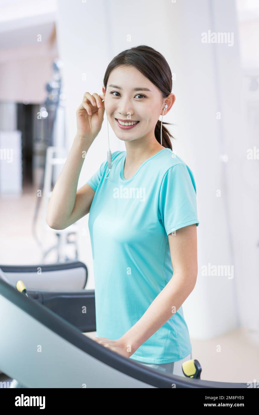 A young woman in the gym for a workout Stock Photo