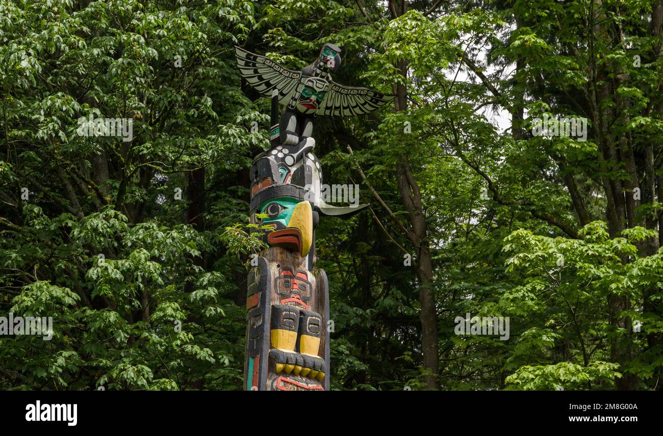 Wooden totem poles in Stanley Park. First Nations culture, travel, national art Vancouver, British Columbia, Canada Stock Photo