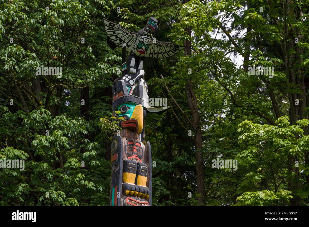 Wooden totem poles in Stanley Park. First Nations culture, travel, national art Vancouver, British Columbia, Canada Stock Photo