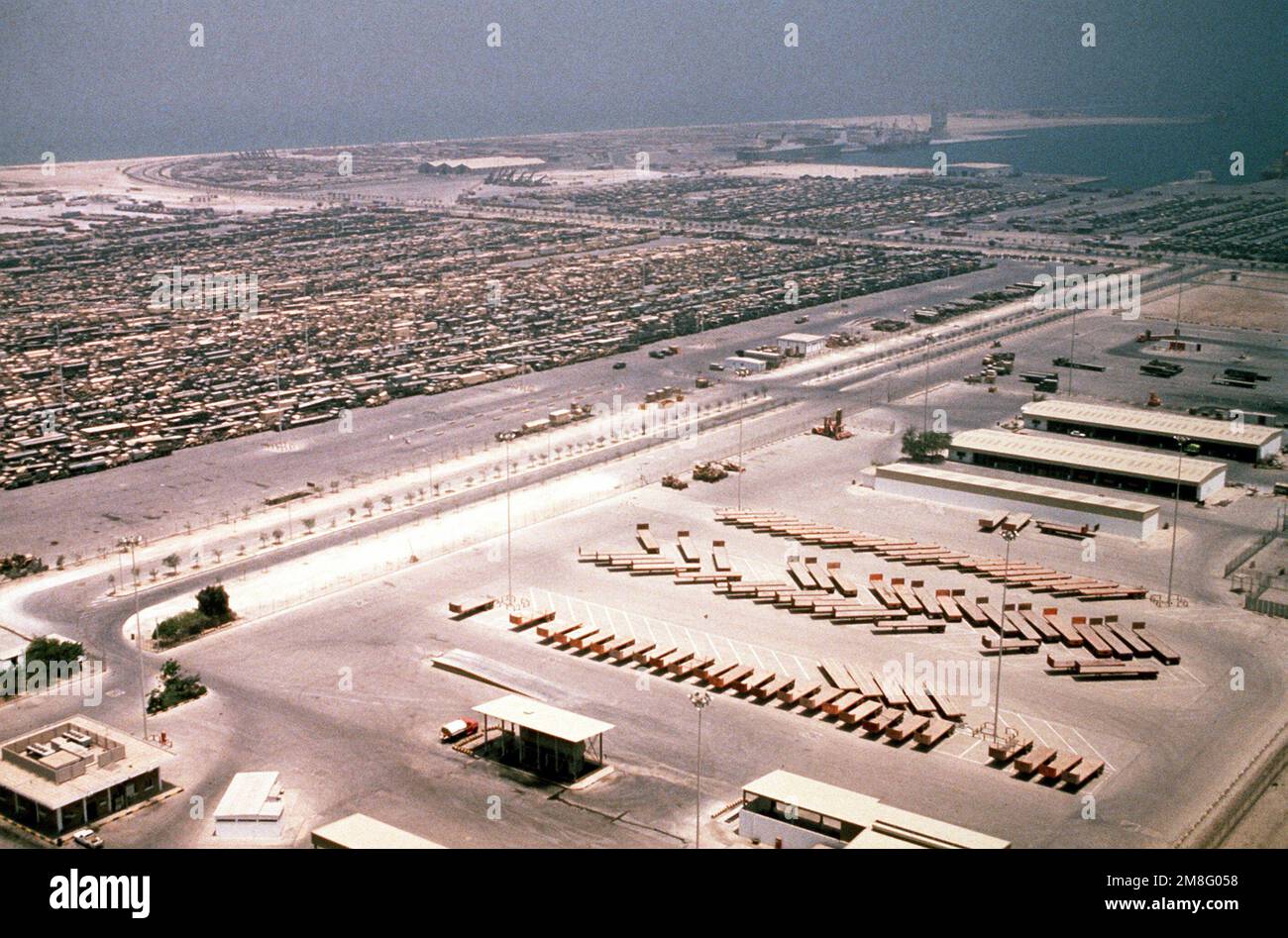 Military equipment lines a holding area near ther port of Dammam in preparation for transportatioan back to the United States in the aftermath of Operations Desert Shield/Desert Storm. Subject Operation/Series: DESERT SHIELD DESERT STORM Country: Saudi Arabia (SAU) Stock Photo