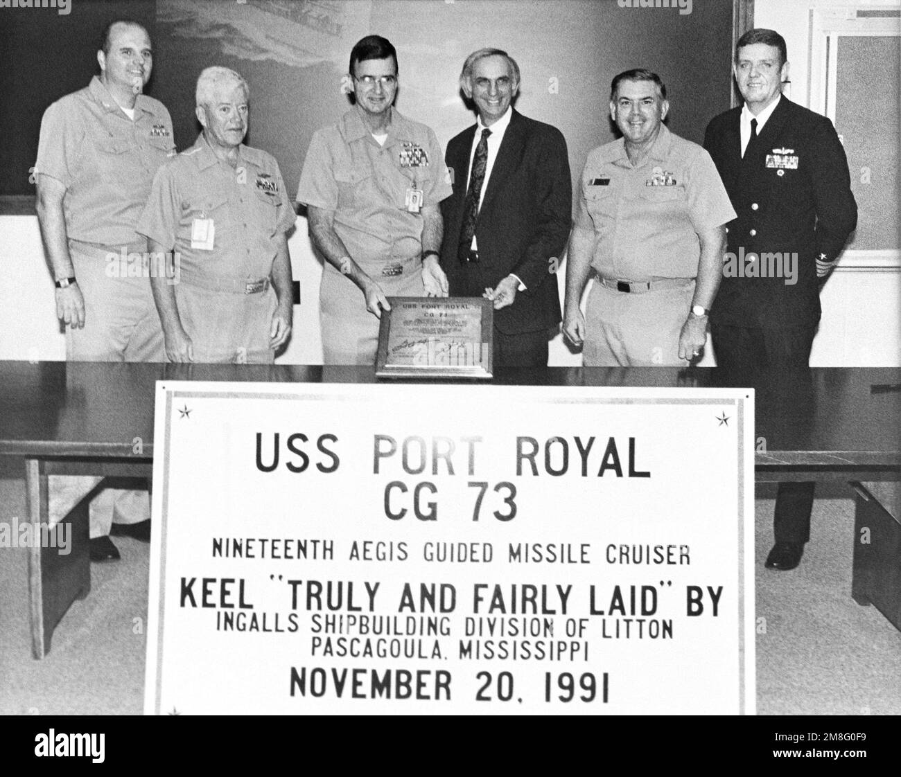 US Navy officials and a representative of Ingalls Shipbuilding pose for a photograph at the keel-laying of the guided missile cruiser USS PORT ROYAL (CG 73). Base: Pascagoula State: Mississippi(MS) Country: United States Of America (USA) Stock Photo