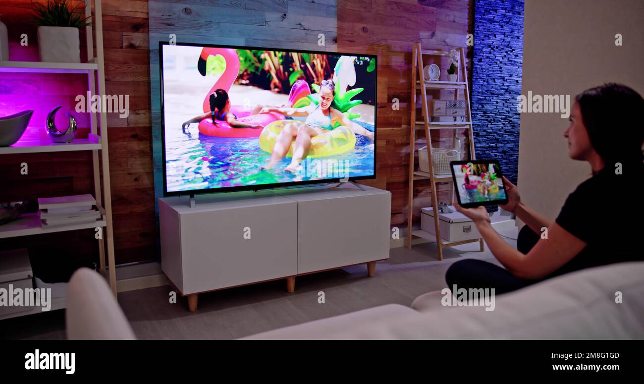 Woman Watching TV Through Tablet Television And Movie Streaming Stock ...