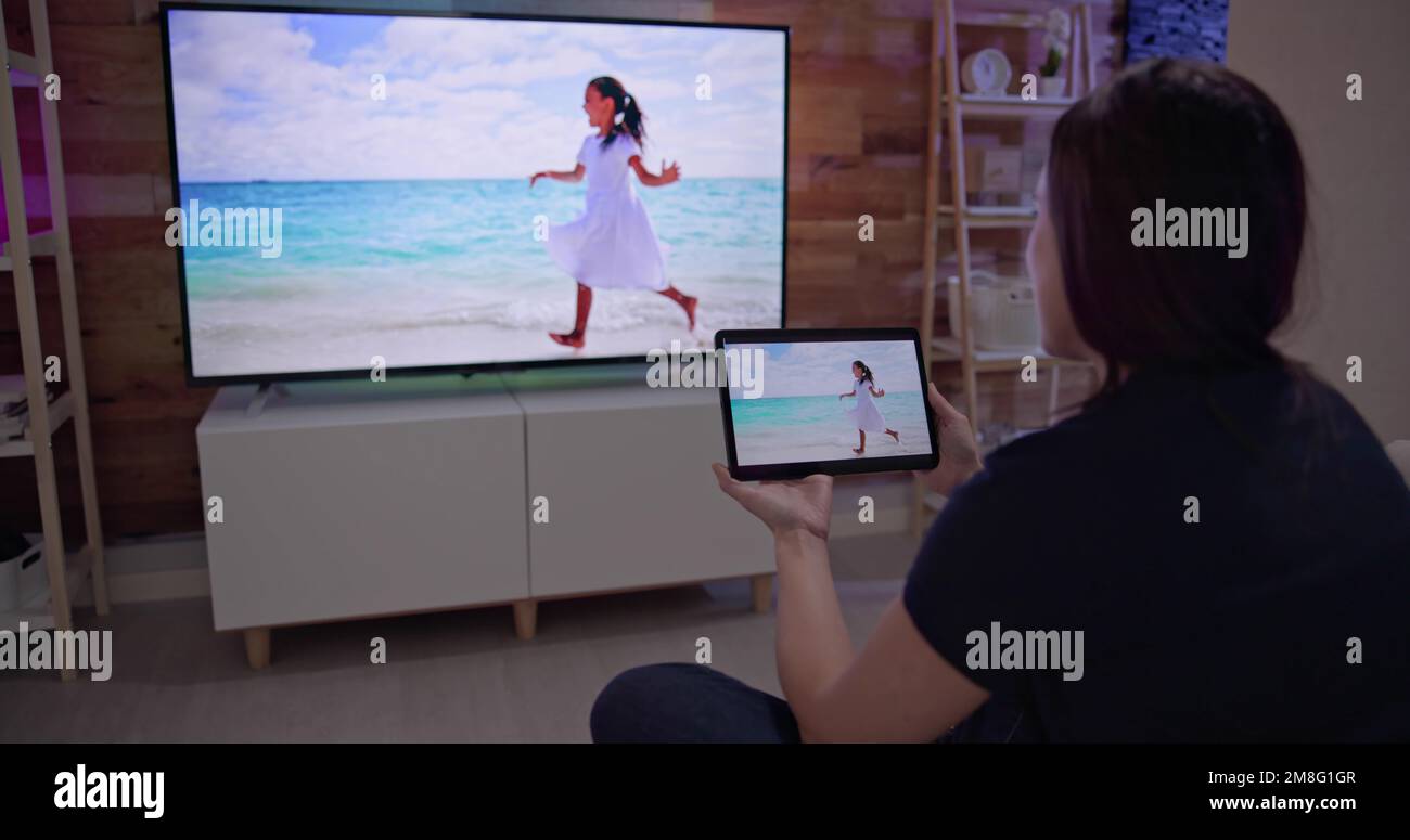 Woman Watching TV Through Tablet Television And Movie Streaming Stock ...