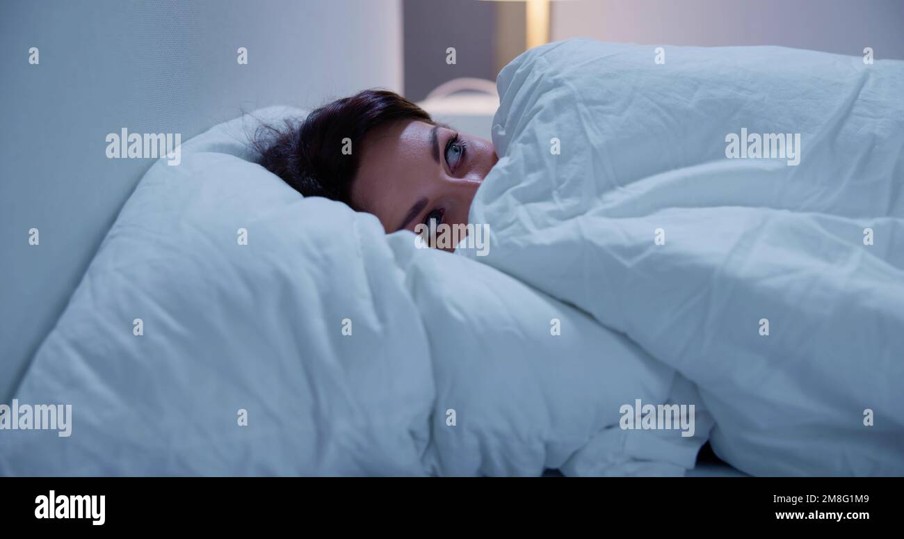 Awake Sleepless Woman Afraid And Scared At Night Stock Photo Alamy