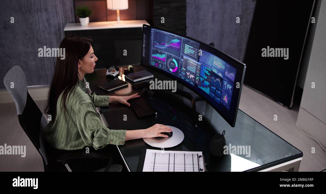 Business Woman Analyst Using KPI Data On Computer Stock Photo