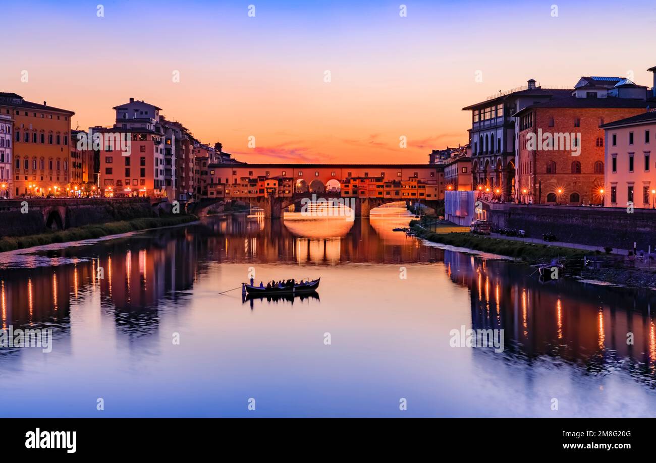 Sunset cityscape with the famous bridge of Ponte Vecchio on the river Arno River in Centro Storico, Florence, Italy Stock Photo